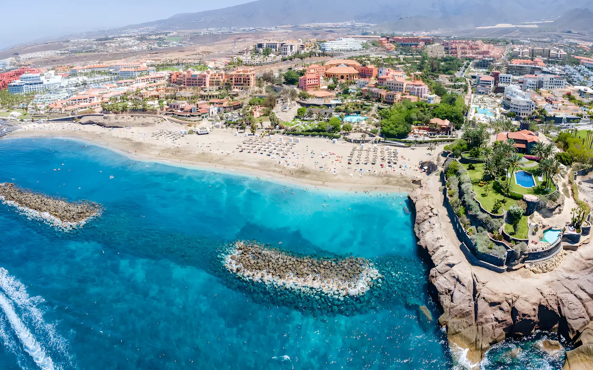 Sunny beach and turquoise sea representing Tenerife's beaches