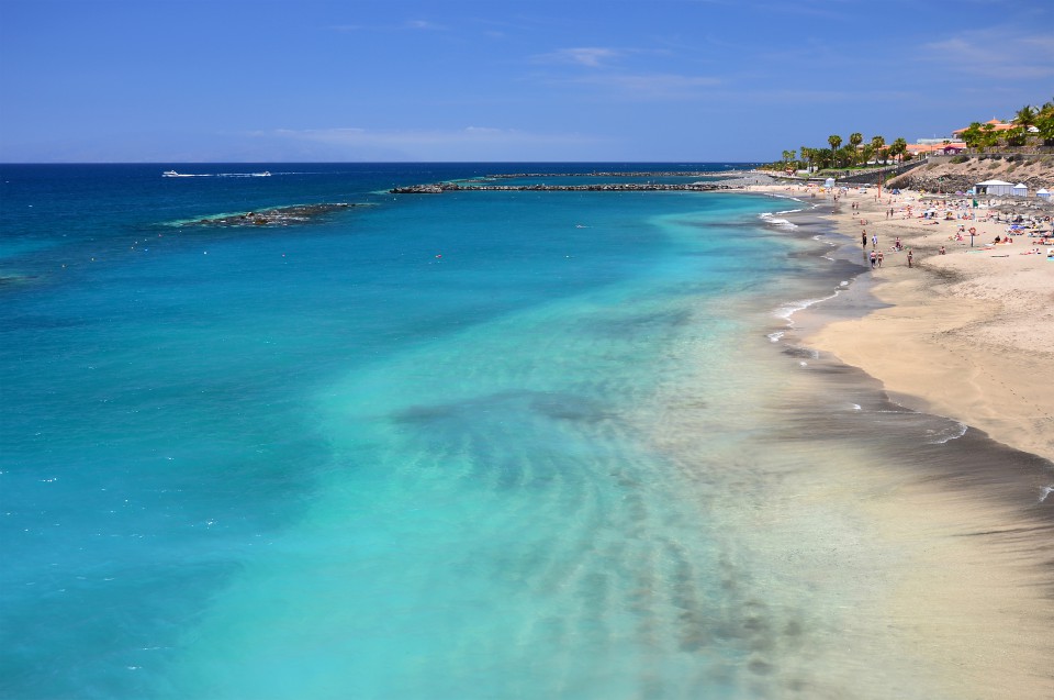 Beach scenery representing Playa del Duque in Costa Adeje